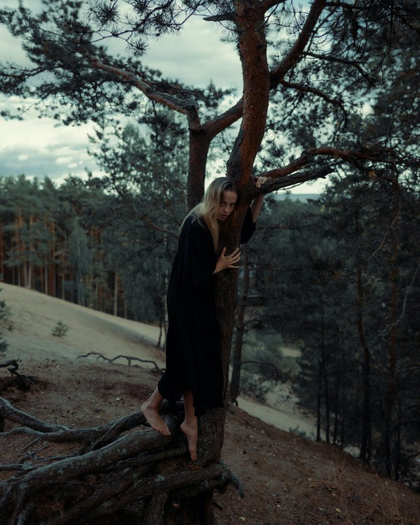 a woman holding a tree